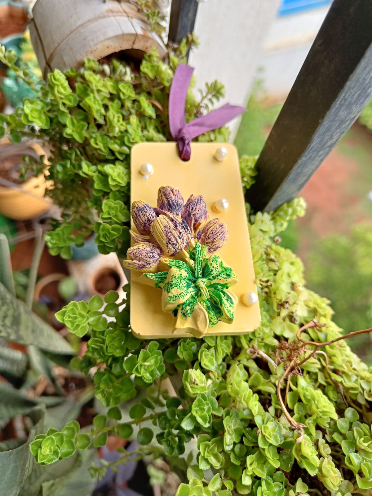Yellow rectangular hanging aroma stone with purple and green flowers