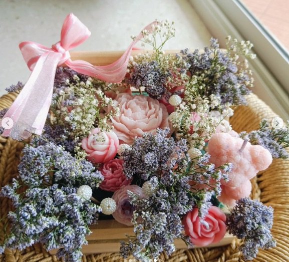 Premium candle bouquet combining florals and handmade candles from the Candle Bouquet Masterclass