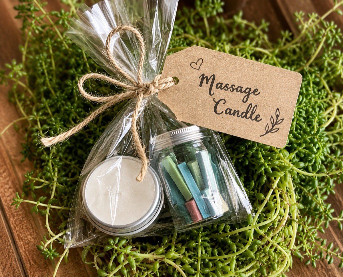 Handmade massage candle melting into warm massage oil from the Massage Candle Masterclass
